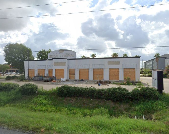 The former Parvani Vida Bridal and Formal building at 7107 Highway 6 South, now boarded up and ready for transformation into a new Firehouse Subs location.